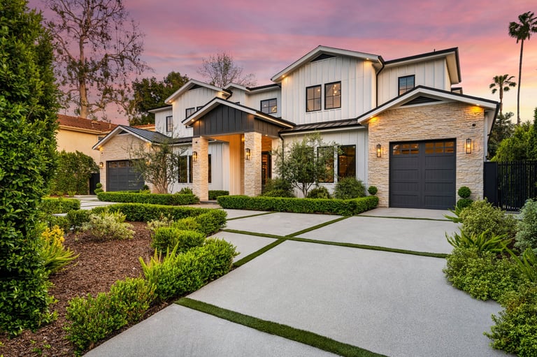 A house in a charming neighborhood with stunning sidewalk landscaping